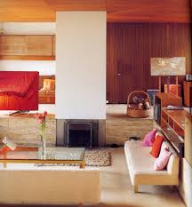 We repainted the fireplace beige tile all white to give it a boost and give it a more updated look without breaking the budget. Ouno Design Sublime 1960s Interior Ouno Design