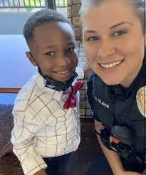 Police Officer's Heartwarming Moment with Young Boy