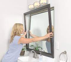 Wondering how to frame a mirror? Mirror Mirror Stuck On The Wall Add A Frame To An On The Wall Plate Glass Mirror In Minutes The Custo Mirror Frame Kits Mirror Frame Diy Bathroom Decor