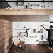 White tile on the walls widens the space visually, while the black and white tiles on the floor harmonize the rest of the room. Small Apartment Architecture And Interior Design Dezeen
