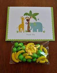 As guests arrive with their gifts, set them on a central table so everyone can admire. Monkey Themed Baby Shower Favors Danielle Bower Safari Baby Shower Favors Animal Baby Shower Monkey Baby Shower