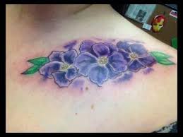 The tattoos of the flowers can be made of many different colors, for example, the violet ones. 11 Very Appealing African Flower Tattoo Designs