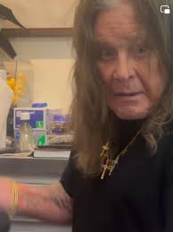 Ozzy Osbourne getting ready to sign for fans at a Horror Con in California  2024
