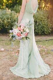 Asymmetrically draped tulle overlays the strapless. Rustic Mint And Peach Wedding Novocom Top