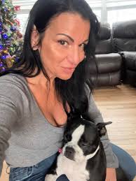 little princess Gracie is gonna spend her first Christmas with me. She  needed some snuggle time with me before I leave to train another fur  friend. Her mom got her Christmas jammers.