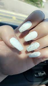 For a straightforward and cute acrylic nail design, french tip your nails white but the rest of your use silver and gold glittered nail polish. White And Silver Glitter Coffin Acrylic Nails Glitter Nails Acrylic Christmas Nails Acrylic White And Silver Nails