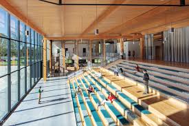 The wooden seat features woodgrain details, making these chairs stand out. 15 Office Projects With Stadium Seating Interior Design Magazine