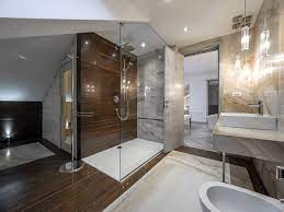 This dark taupe wall adds a sense of richness and luxury to the bedroom area, while setting up the palette for the bathroom with quiet neutrals. Pin On Bathroom Decor