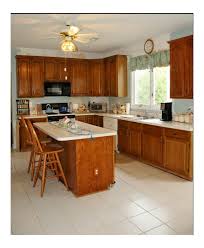 If your cabinets don't go all the way to ceiling, a great way to update the look is to close off the area above the cabinets. Adding 12 Upper Cabinets To Already 42