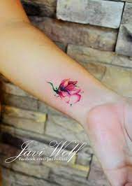 Cover up tattoos live2tattoo graphic abstract. Flower Watercolor Tattoo On Girl S Wrist Flower Tattoo Girl Watercolor Wrist Tattoos Beautiful Flower Tattoos Watercolor Tattoo Flower