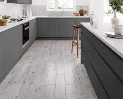 Plus, when it comes to resale value, 90% of real estate agents say homes with hardwoods sell for more money. Kitchen Flooring Ideas The Top 25 Trends Of The Year Grey Wooden Floor Kitchen