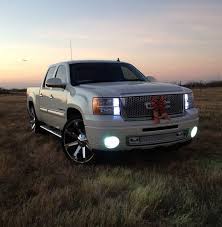 2009 Pearl White Slt Gmc Sierra On 26 Kmc Slide With A Denali Front Conversion Bumpers Painted To Match Fact Customised Trucks Dropped Trucks Chevrolet Trucks