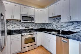 Check our colorful granite kitchen countertop ideas. White Kitchen Cabinets With Black Countertops Walls And Floor Colors Backsplash Ideas