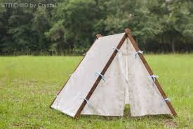 Cut poles for teepee tent. 9 Easy Diy Outdoor Tents And Teepees Shelterness