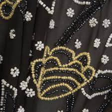 Black and gold engraved ink art. Black Floral Hand Beaded Silk Georgette Joel Son Fabrics