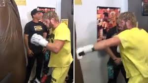 Floyd mayweather (l) and logan paul face off during media availability ahead of their june 6th exhibition boxing match on june 03, 2021 at villa casa casuarina at the former versace mansion in miami beach, florida. Tinbhsah6xx8m