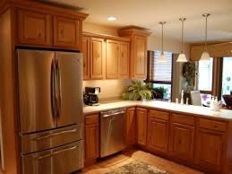 Update Cabinets By Removing The Spindle Trim And Adding The Crown Molding Maybe With Ligh Cheap Kitchen Remodel Kitchen Remodel Small Kitchen Remodel Layout