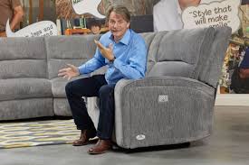 You can place the ottoman on eithe. Bentley Chenille Power Reclining Sectional