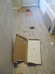 In this hardwood floor installation video we show you how to install hardwood flooring over tile floor double glue down method with underlayment. How To Install An Adhesive Vinyl Bathroom Tile Floor Merrypad