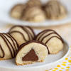 Eggs, sprinkles, sugar cookie mix, butter, hershey's kisses. 1
