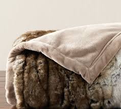 This sumptuous blanket features a velvety soft feel that mimics real fur, minus the expense and ethical concern. Faux Fur Textured Ombre Throw Pottery Barn