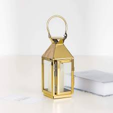 Lovely addition to outdoor patio settings or indoor decoration. 8 In Tall Gold Metal Lantern Candle Holder Centerpiece