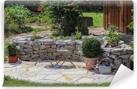 Sie sorgt für eine warme ausstrahlung und eine gemütliche atmosphäre und kann natürlich. Sitzplatz Im Garten Mit Krauterbeet Wall Mural Pixers We Live To Change