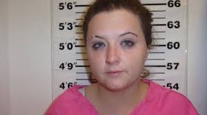 Sheriff warns others after woman allegedly caught throwing contraband over  jail fence