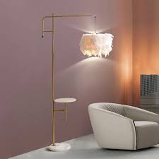 The ostrich feather floor lamp is an illuminating palm tree the aynhoe ostrich feather floor lamp is available in sixteen opulent hand dyed shades and four hand finished resin base tones. Pin On Lamp