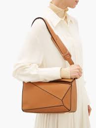 Anderson in fashion speak) for loewe. Tan Puzzle Medium Grained Leather Cross Body Bag Editorialist