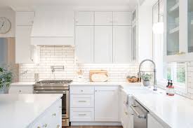 Metal mixing with lighting is our favorite way to get the mixed metal look. Gorgeous All White Kitchen With Mixed Metal Fixtures And Hardware Kitchen Remodel Small Kitchen Layout White Modern Kitchen