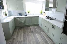 Unlike the previous combination, the combo between pure white and olive tends to create a clean and refreshing look. Burnham On Sea Sage Green Transitional Kitchen Other By Walrow Kitchens Houzz