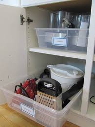 What are your favorite tips for organizing kitchen cabinets? For Those Large Deep Cabinets With Hard To Reach Places Label A Big Plastic Bin And Store E Kitchen Hacks Organization Kitchen Organization Home Organization