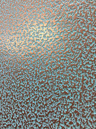 Unlike typical wallpaper, textured versions use various materials and raised detailing to really make an impression. Patina Textured Wall Metal Texture Painting Textured Walls Wall Paint Designs