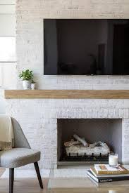 Painted brick fireplaces, precast fireplace surrounds, reclaimed wood mantels, white millwork mantels, and even faux fireplaces made with antique mantels. White Brick Fireplace Design Ideas