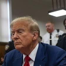 Donald Trump 'slumped back in chair' with eyes closed and gives fist pump  outside court