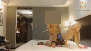 Watch the video and choose the correct answer. Busty Blonde Hooker Fucking With Her Client In The Hotel Room