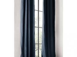 I got stock drapes for the guest bedroom and then added designer tape trim for a custom look. Washed Belgian Linen Drapery