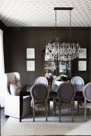 Dining room with light blue walls and wainscoting boasts blue leather round back french chairs at a brown wooden dining table and blue stripe french settees illuminated by a chandelier. Ceiling Wallpaper Dining Room Chocolate Brown Paint Color Wallpapered Ceiling Star Wallp Black And White Dining Room Dining Room Wallpaper Brown Dining Room