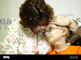 David Dingman-Grover, a nine-year-old boy of Sterling, Va., who was  diagnosed in May 2003 with a rare kind of brain cancer, looks at his  mother, Tiffani Dingman-Grover, Tuesday, Feb.1, 2005, during a