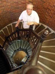Rev Ray Herrmann with a secret spiral staircase at St Andrews Uniting  Church. Picture: Bruce Long