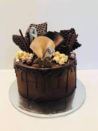 With presents and balloons, with parties and candles, and of course with chocolate. Chocolate Drip 16th Birthday Cake Slice Of Heaven Cakes Facebook