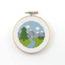 This minimalist cross stitch pattern uses warm purples contrasting with black and greys to depict an old fashioned street lamp and the light and shadows it casts. River Cross Stitch Pattern Pdf Pattern Landscape Cross Stitch Minimalist Cross Stitch Mountain Cross Stitch Nature Cross Stitch Cross Stitch Patterns Cross Stitch Stitch Patterns