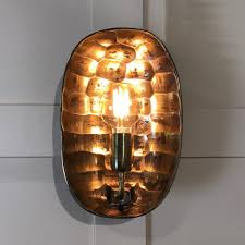 This 1 light wall sconce from the americana collection by kalco will enhance your home with a perfect mix of form and function. Antique Bronze Curved Tortoise Wall Light Cowshed Interiors