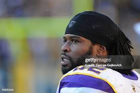 Defensive lineman Brian Robison and cornerback Benny Sapp of the... News  Photo