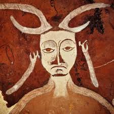 cave painting of a man with antlers, altamira, ochre,