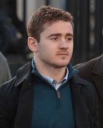 Woman who claims she was raped by Ireland rugby star Paddy Jackson 'did not  appear to take her eyes off him' at Belfast house, pal Rory Harrison tells  court in statement |