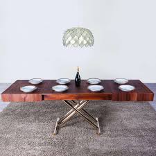 Caractéristiques table basse transformable en table pour 14 persone plateau extensible par le biais de rallonges (2 internes, 2 externes) réhaussable avec vérin à gaz au millimètre très polyvalente dans son utilisation et emplacement plateau et structure disponible en nombreuses finitions. Table Relevable Extensible Pour Petit Espace En Bois Ulisse 4 Pieds Com