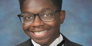 A cap, gown and red roses in his chair'