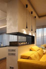Dividing a room often makes a room look smaller and awkward. Room Divider Fireplaces Real Fire Without Smoke Planika